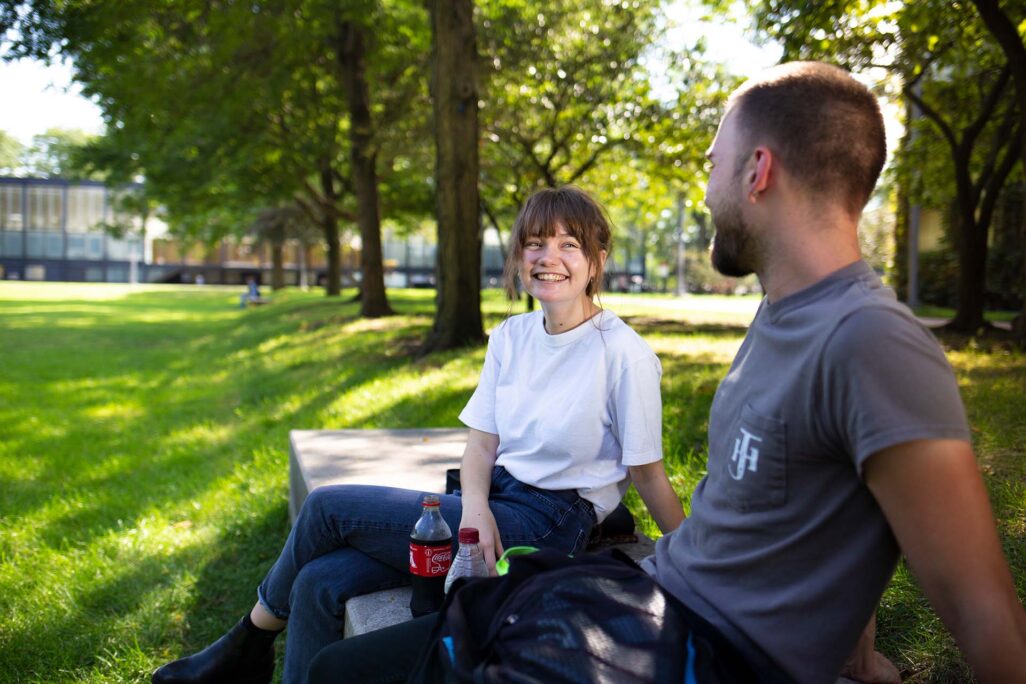 iit_about_image-1 Couple on bench outside Illinois Tech campus