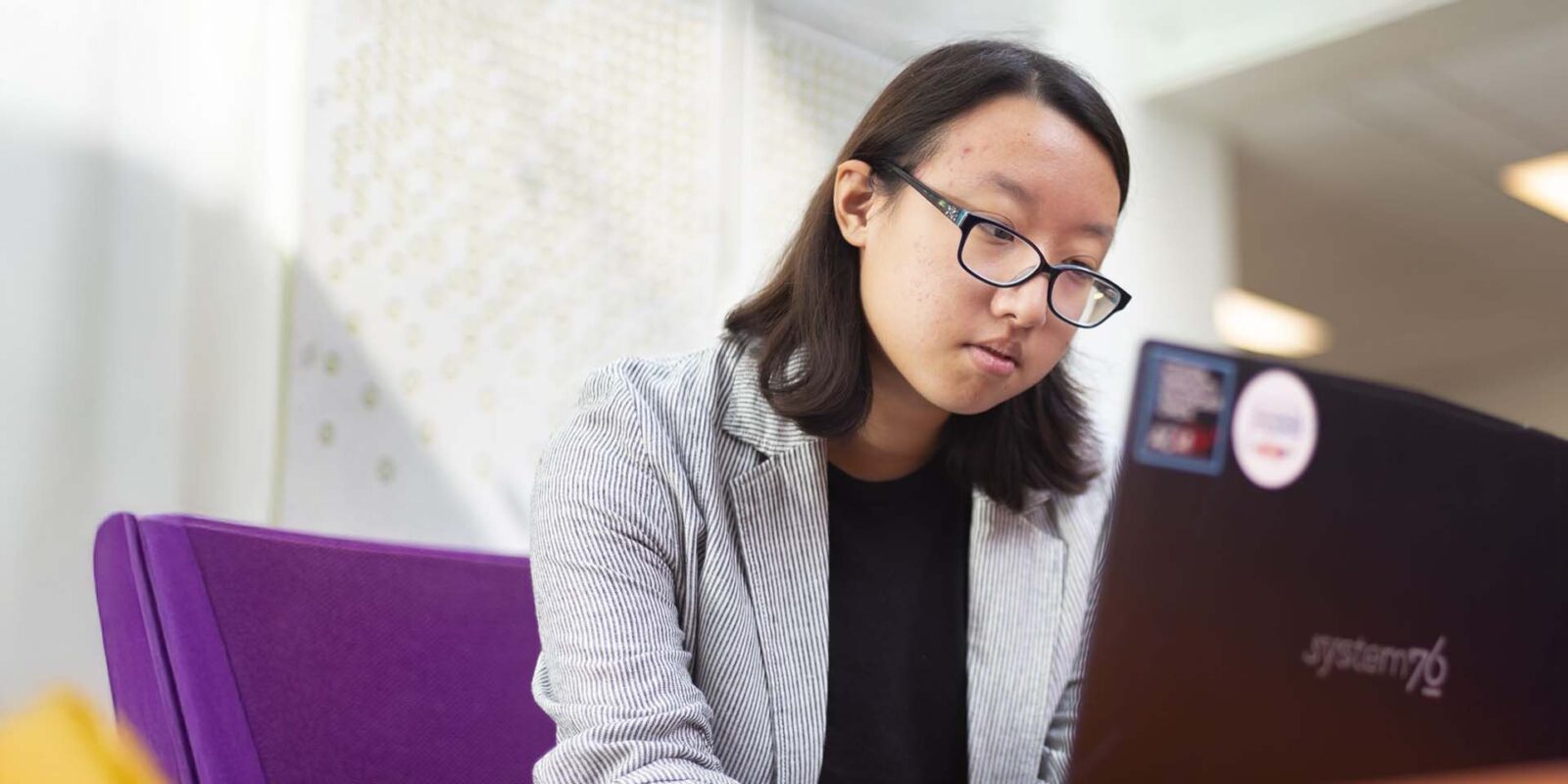 student at desk studying for exam in health physics class
