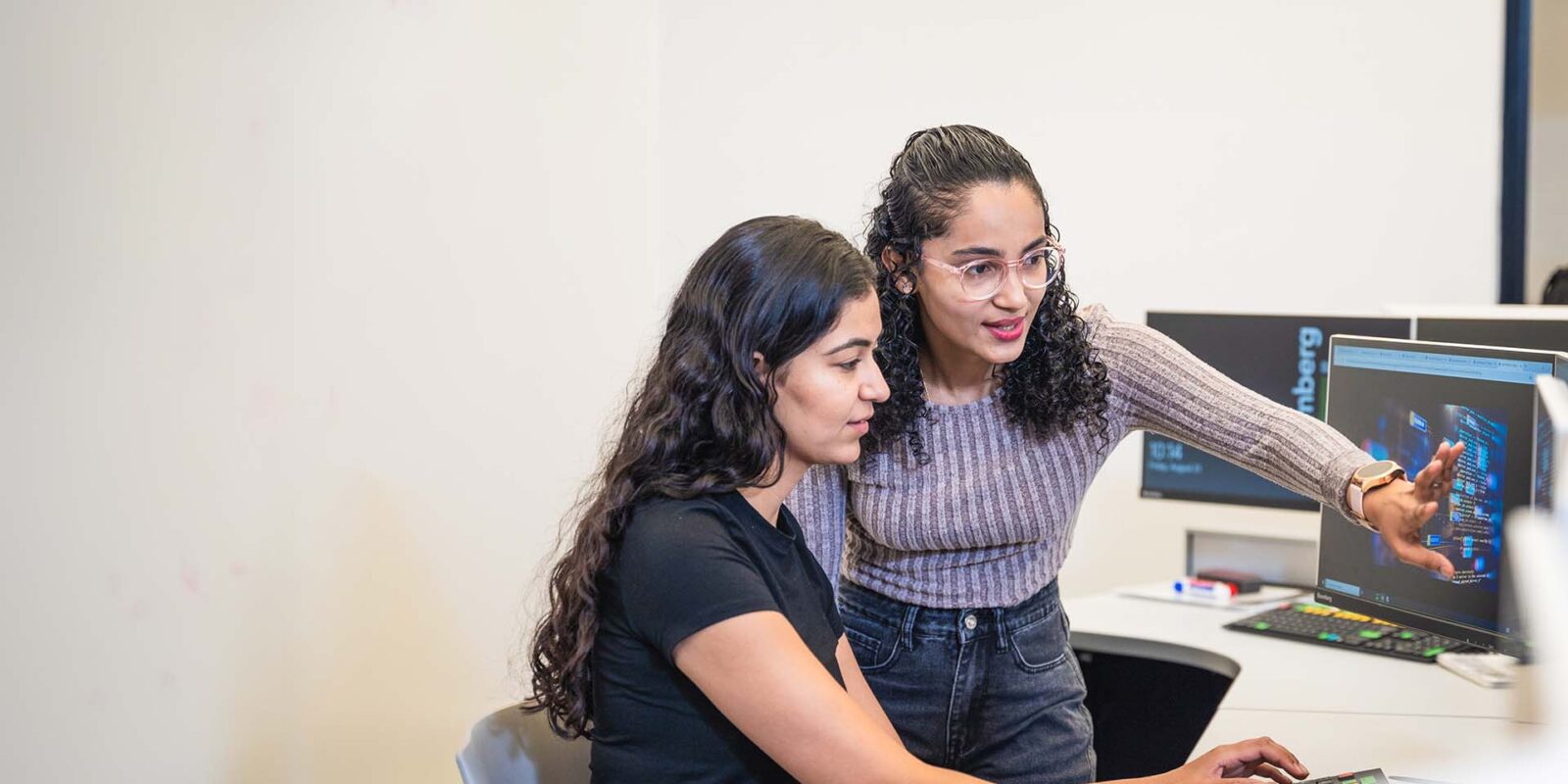 students in the MPA program reviewing data on screen in lab